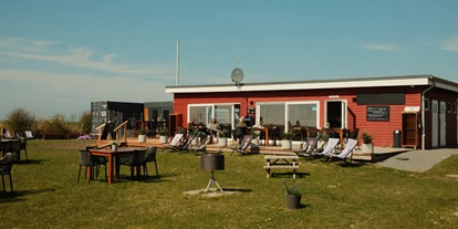 Kite school - Saisonzeiten: Juli - Schleswig-Holstein - Cafe & Bistro - Primesurf Fehmarn - Cafe & Bistro / Kitesurfschule und Wingfoilcenter