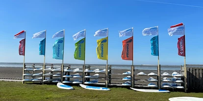 Scuola di aquiloni - Integrierter Kiteshop & Service - Nordseeküste - Windloop Pro Center + Strandbar